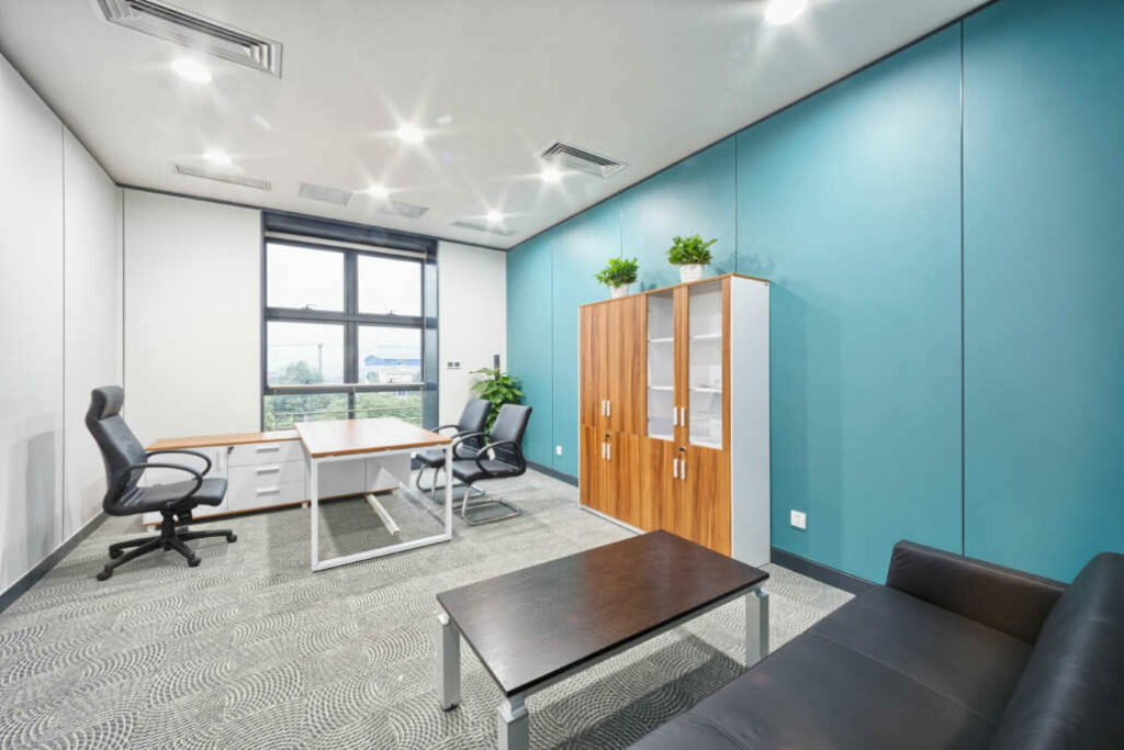 Office with a teal accent wall and professional interior paint design by a commercial painter in Marin County, CA.