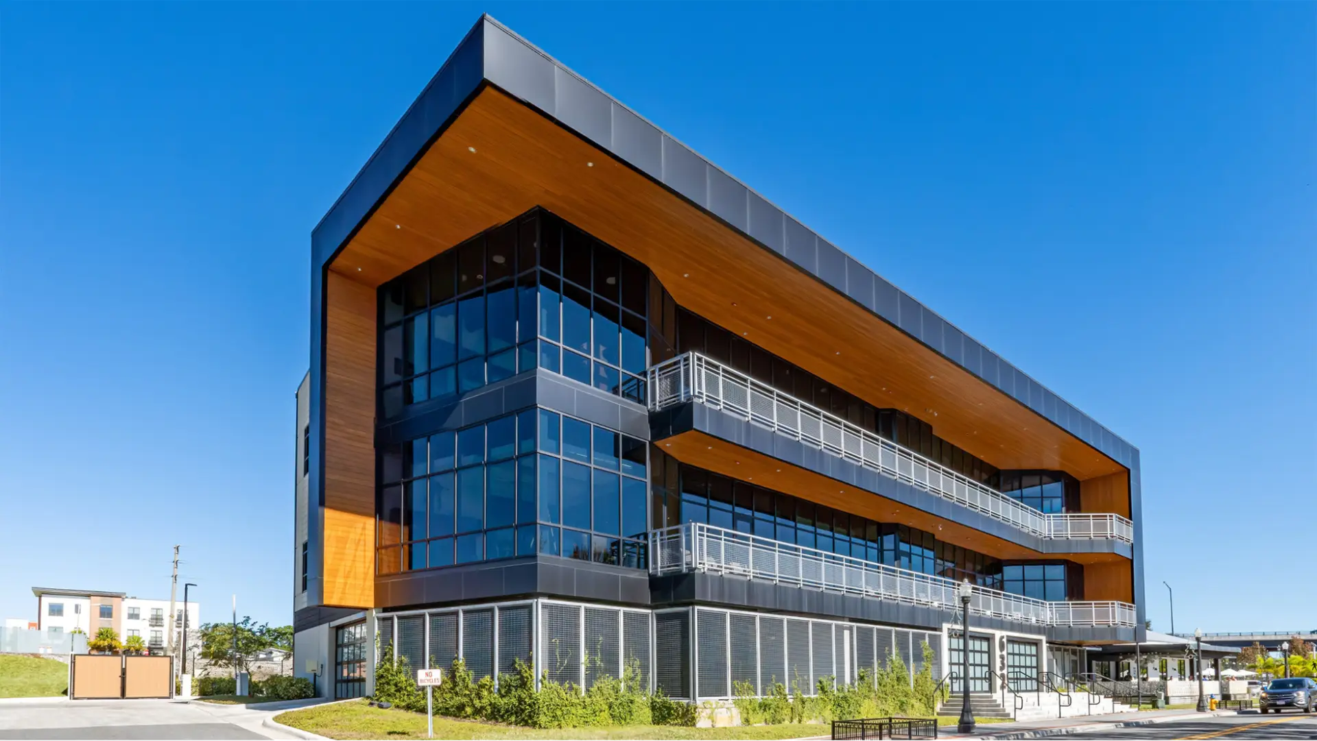 Office building with black exterior panels and warm wood soffits by a painting company in Mill Valley, CA