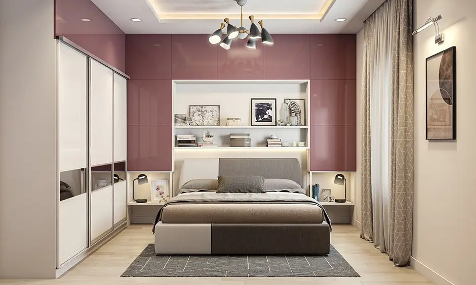 Bedroom with dusty rose accent walls and crisp white trim by a house painter in Marin County, CA.