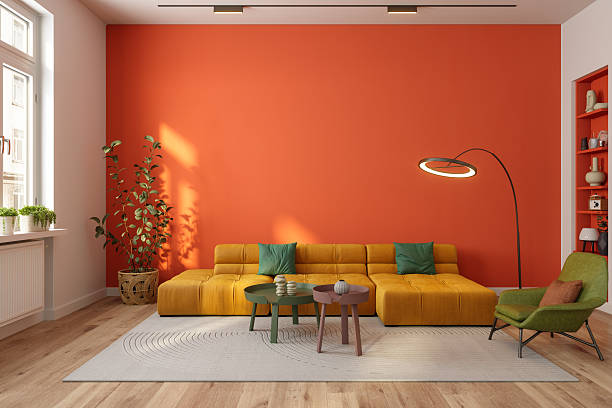 Living room with a bold terracotta-orange accent wall and a smooth finish by an interior painter in Tiburon, CA.
